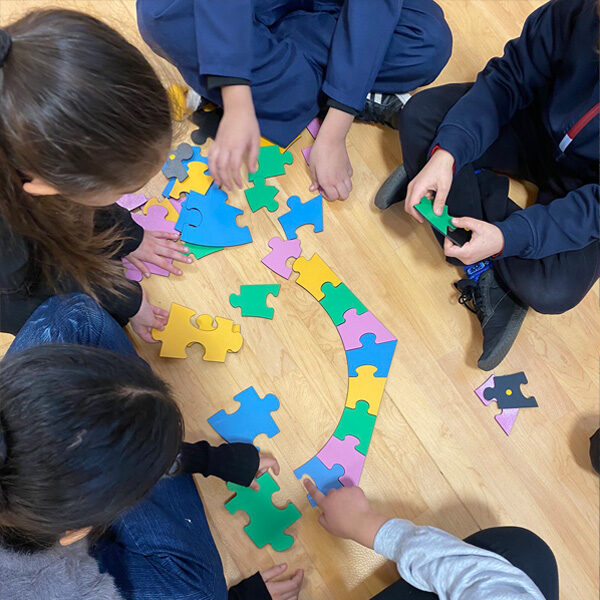 School children in a maths puzzle challenge workshop